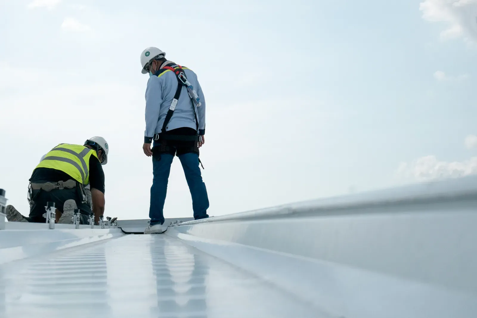 A commercial roof being installed with EPDM coating, hero-approved. | New Jersey Gutter