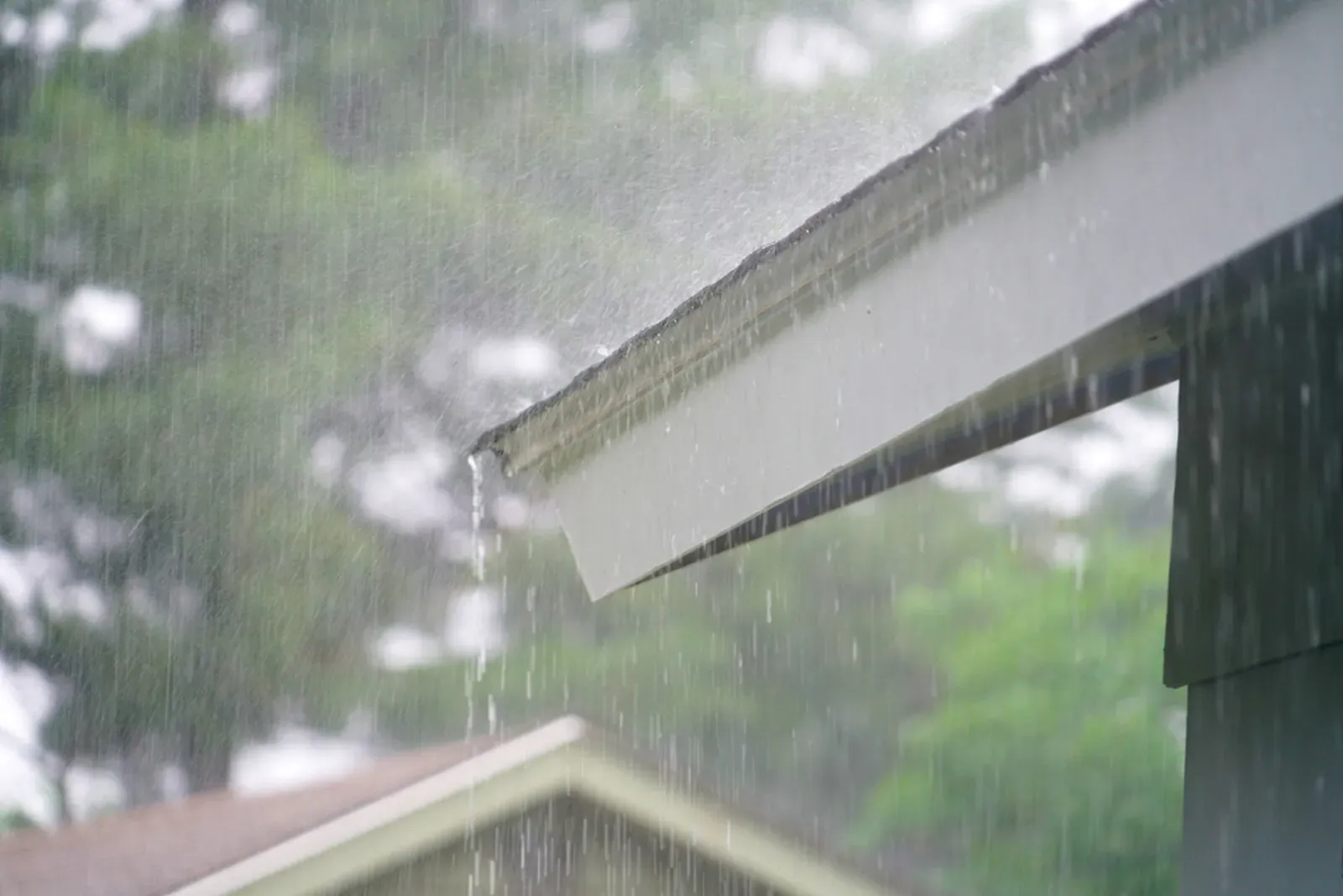 A damaged asphalt residential roof after a storm. | New Jersey Gutter