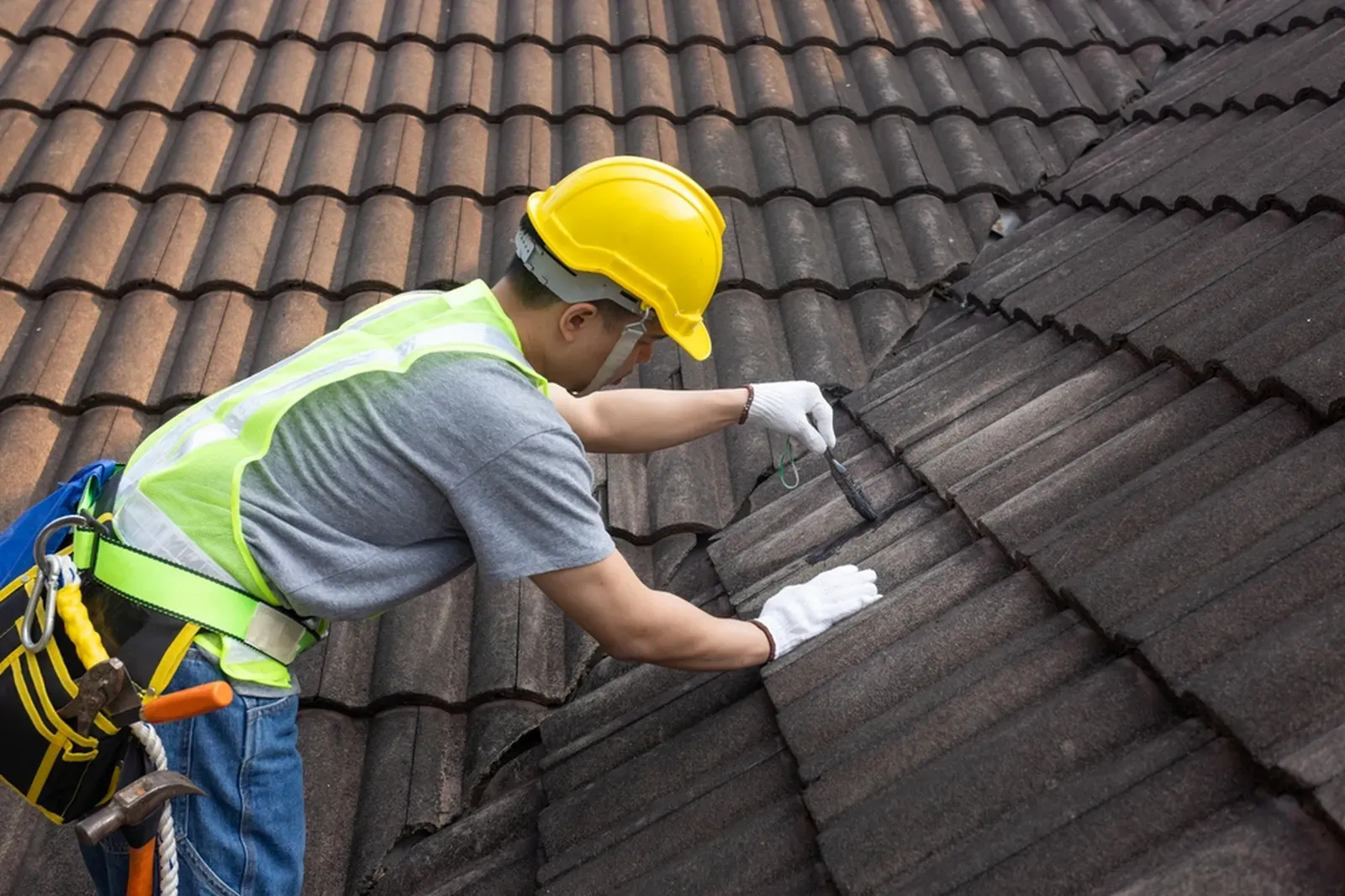 A residential roof repair with roof tiles, hero-approved. | New Jersey Gutter